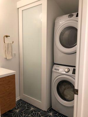 Bathroom/Laundry room remodel (After) sliding door designed by Nick to hide our machines.