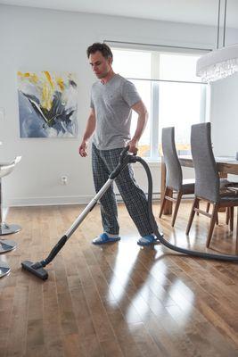 Vacuuming wood floors.