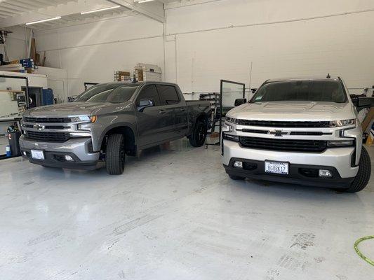 Pair of 2020 Chevy trucks being tinted