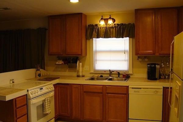 Furnished Kitchen with all you need to make a home cooked meal...or just warm up take out.