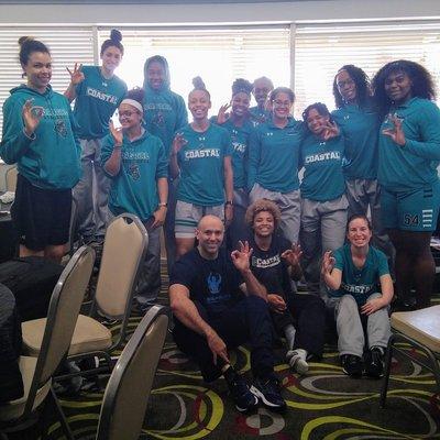 Coastal Carolina Chanticleers pause for photo op after team sports massage during the Sunbelt Women's Conference Champion Tournament