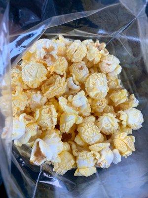 They state "the best popcorn in town"...it is pretty good!!!  $1 for large bag $2 for x-large.