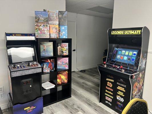 Arcade cabinets you can play for free and some board games for sale