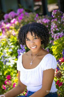 If you've ever driven by our studio, you know we have some of the best flowers in town, perfect for a pop of color in your senior photos.