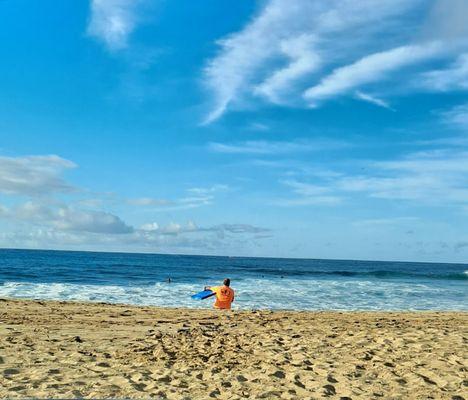 On Christmas day at Makaha Beach.  Thanks for my bright orange jersey I got from your shop. Now the wife can see me out there  ... lol