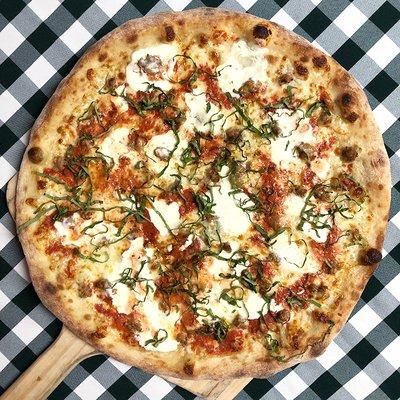 Rotating Pizza Lab: "Sauced n Buzzed"

Vodka sauce base with aged mozz, creamy ricotta, Italian sausage and basil.