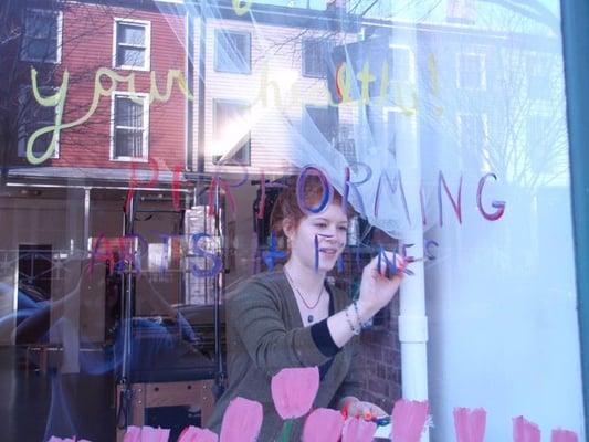 Cadence updating the Brooklyn Strength front window.