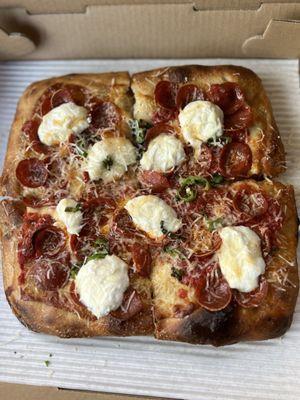 The viral famous pepperoni pizza with garlic ricotta and little slivers of shishito peppers