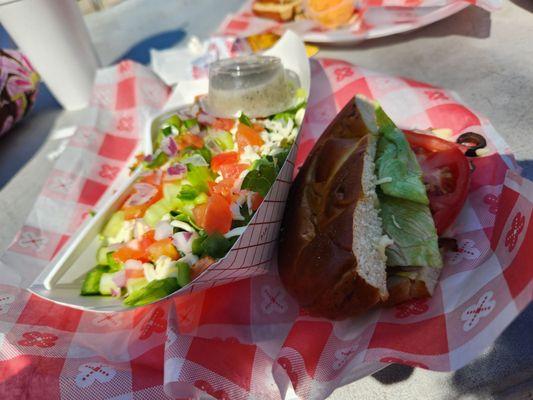 My sandwich and salad. The pretzel bun was awesome!