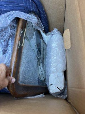 This tray was packed in a wardrobe box next to a solid brass lamp. The only barrier is the small bubble wrap. The box was very damaged.