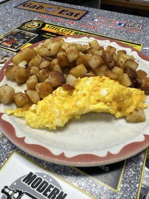 Home fries and scrambled eggs with cheese