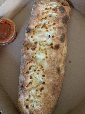 Calzone with shrimp and broccoli