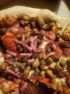 Sloppy meat lover's pizza or maybe just a pile on of meat