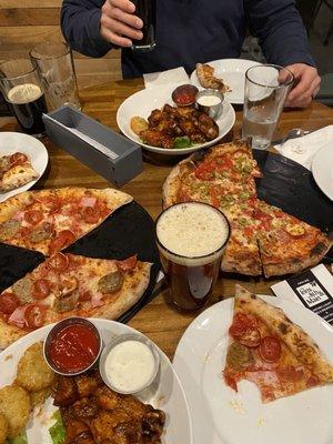 Delicious pizza and wings