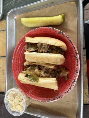 Philly cheesesteak with pickle and mac salad