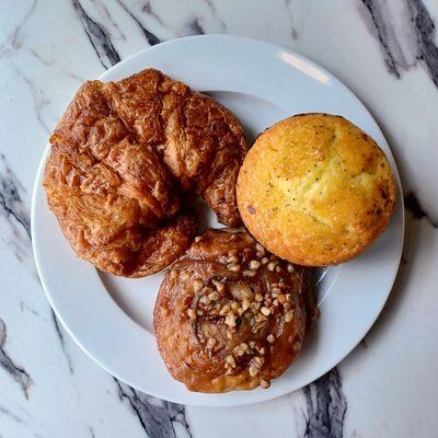 Butter croissant, lemon poppy seed muffin, and a sticky bun