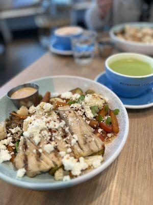 Warm chicken ancient grains bowl and Matcha Latte at Bluestone Lane Avery Cafe