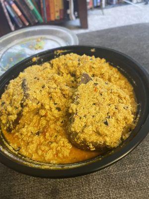 Egusi stew with goat meat and oat fufu