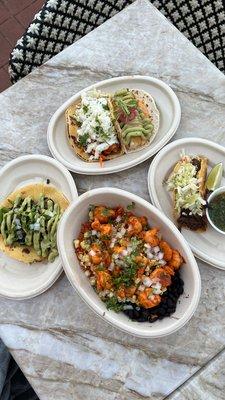 Assortment of tacos and the shrimp bowl