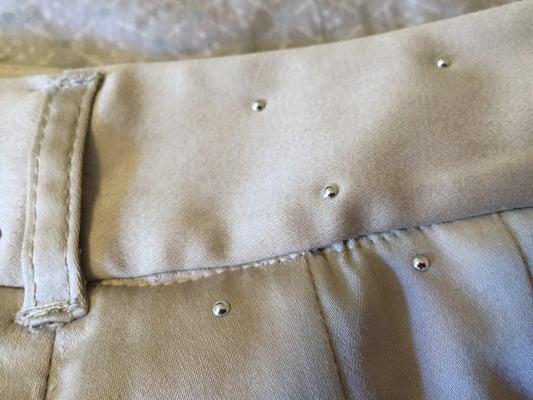 Waistband stitching after alteration, very crude.