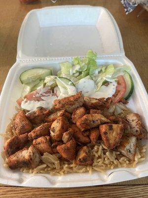 Grilled chicken with rice and salad with a ranch