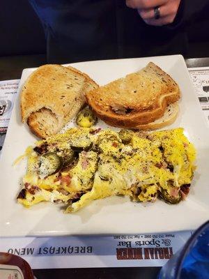 Meat lover's omelet and rye toast