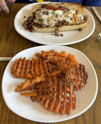 Philly cheesesteak and sweet potato waffle fries