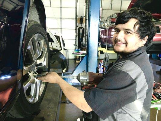 Sergio working on the 370z, the half-tame race car. EVERYTHING got a torque final check... including bolts on the undercarriage skid pan!