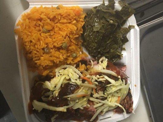 BBQ ribs with a spicy pickling poured on top, yellow vegetable rice, and collars greens