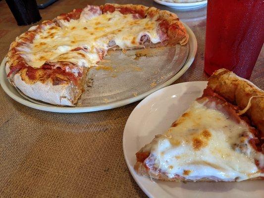 "Denver" crust pizza with sausage, pepperoni, Canadian Bacon.