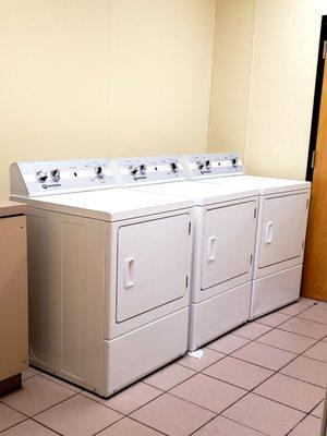 Three washers and three dryers are available for laundry.