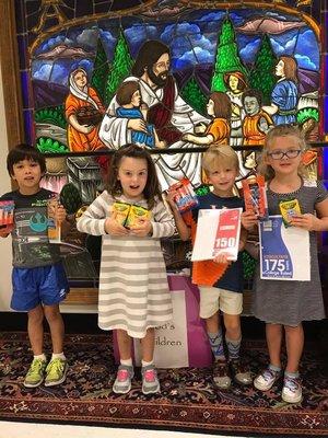 Children learn about helping others with our All God's Children Outreach projects.