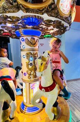 Birthday guest, Catherine enjoying the carousel ride!