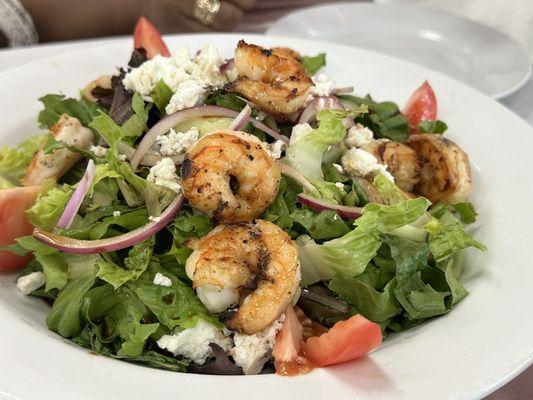 Greek salad with grilled shrimp.