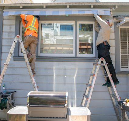 The installation team for the awning for our modest residential project in Noe Valley.