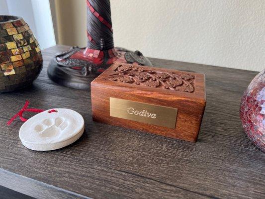 Wooden urn box, paw print ornament