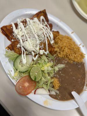 Chicken enchiladas with rice and beans