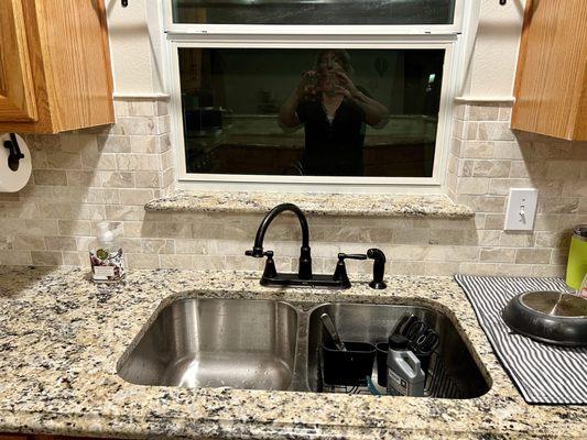 Finished granite countertop and upgraded heavy guage steel sink