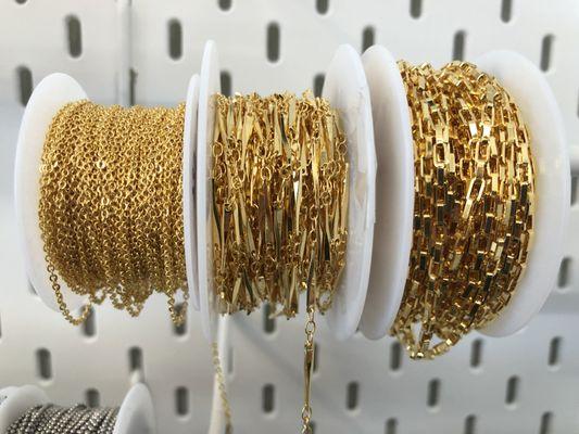 We carry 14k gold, Sterling Silver, and all base metal chains. We are happy to add clasps and jump rings or show you how to do so yourself.