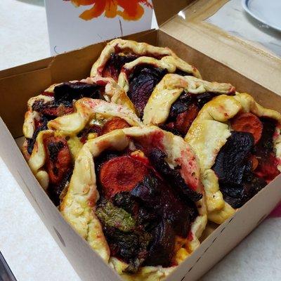 Fresh roastes B&G Garden beets & carrots along with blue cheese in a folded butter pastry.