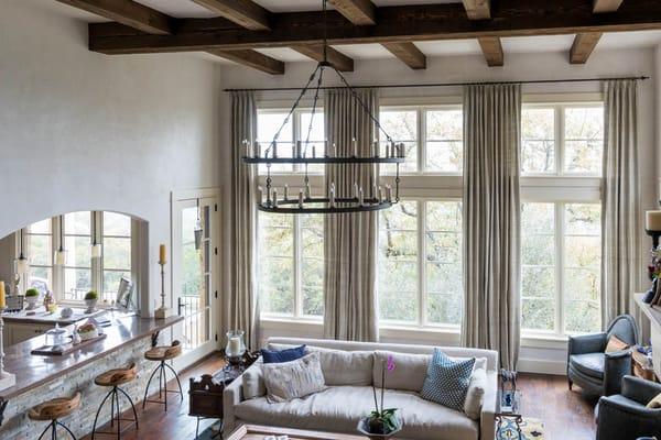 Designer Jon Wallace created the stunning window treatments for this beautiful living area in Austin.