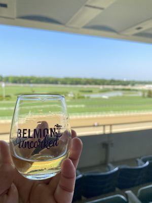 Tasting glass from Belmont Uncorked and view of the track.