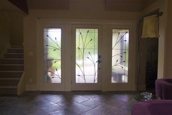 Custom ironwork on glass entryway