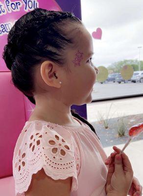 My daughter rocking her side braid and glitter tattoo!