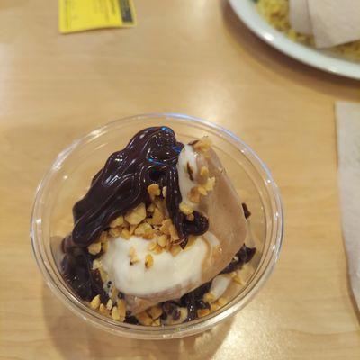 Vanilla peanuts and chocolate syrup ice cream