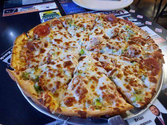 Medium pizza with green pepper, pepperoni and extra cheese.