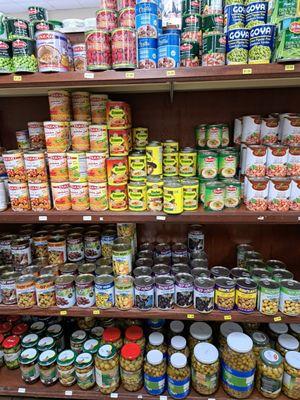 Canned and jarred goods: hummus, fava beans, olives, baba ghanoush, green pigeon peas, kidney beans