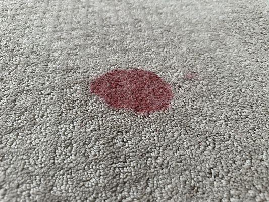 Red stain from kids slime toy - closeup