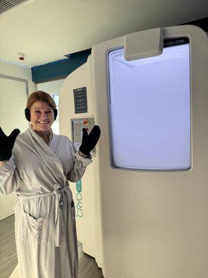 Me next to the cryotherapy room. That window opens so you don't feel claustrophobic at all!