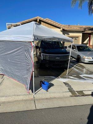 Laying the coats on the truck.